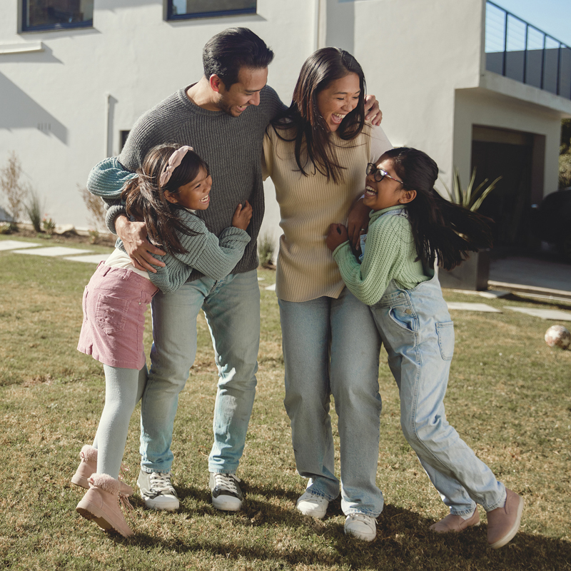Family in front of new home